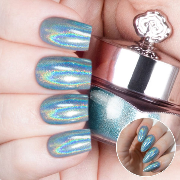 Nails featuring a pale, icy blue holographic powder with a delicate shimmer.
