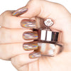 Nails featuring a rose-gold copper base holographic powder with a radiant, shimmery finish.

